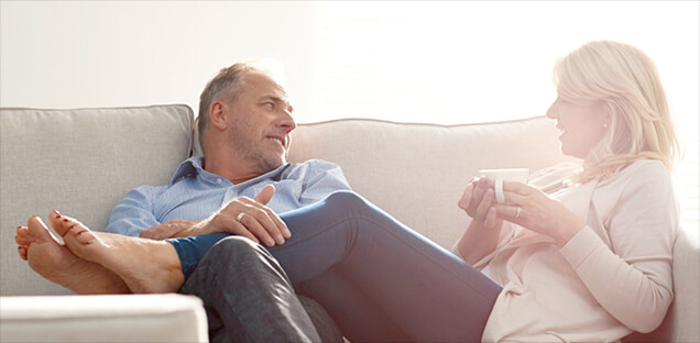 Couple Talking to Each Other on Couch