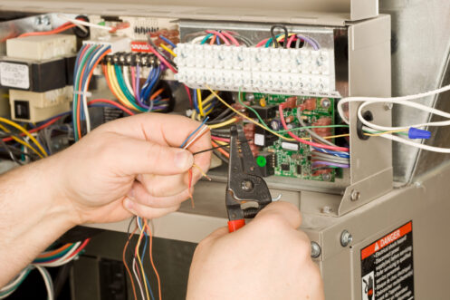 Technician repair HVAC equipment