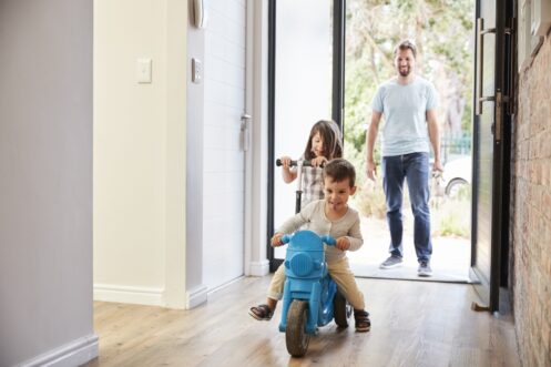 Family Entering Home after Service for Indoor Air Quality in St. Louis, MO