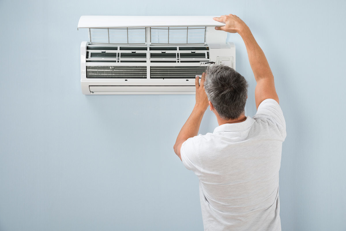 St. Louis man checking ductless mini split